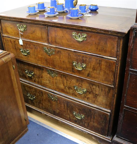 A walnut chest of two short and three long drawers, W.102cm
